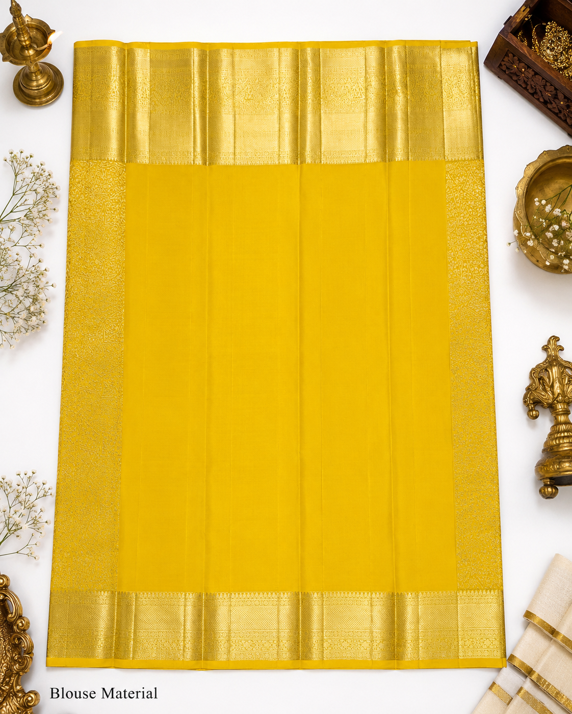 Yellow saree with gold border on a white background