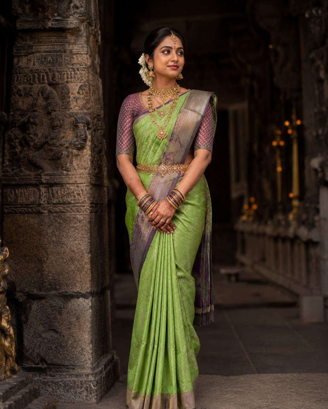 Leaf green Kanjivaram silk saree with purple border and gold zari, draped on model — Leaf Green Kanjivaram Silk Saree, Vasthara Boutique