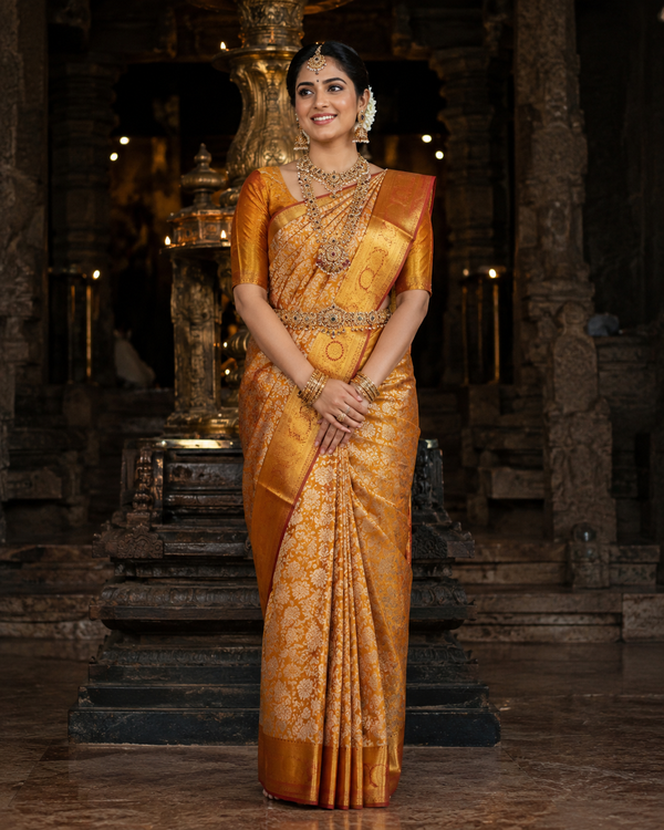 Marigold yellow Kanjivaram silk saree with maroon border and gold zari, draped on model — Marigold Yellow Kanjivaram Silk Saree, Vasthara Boutique
