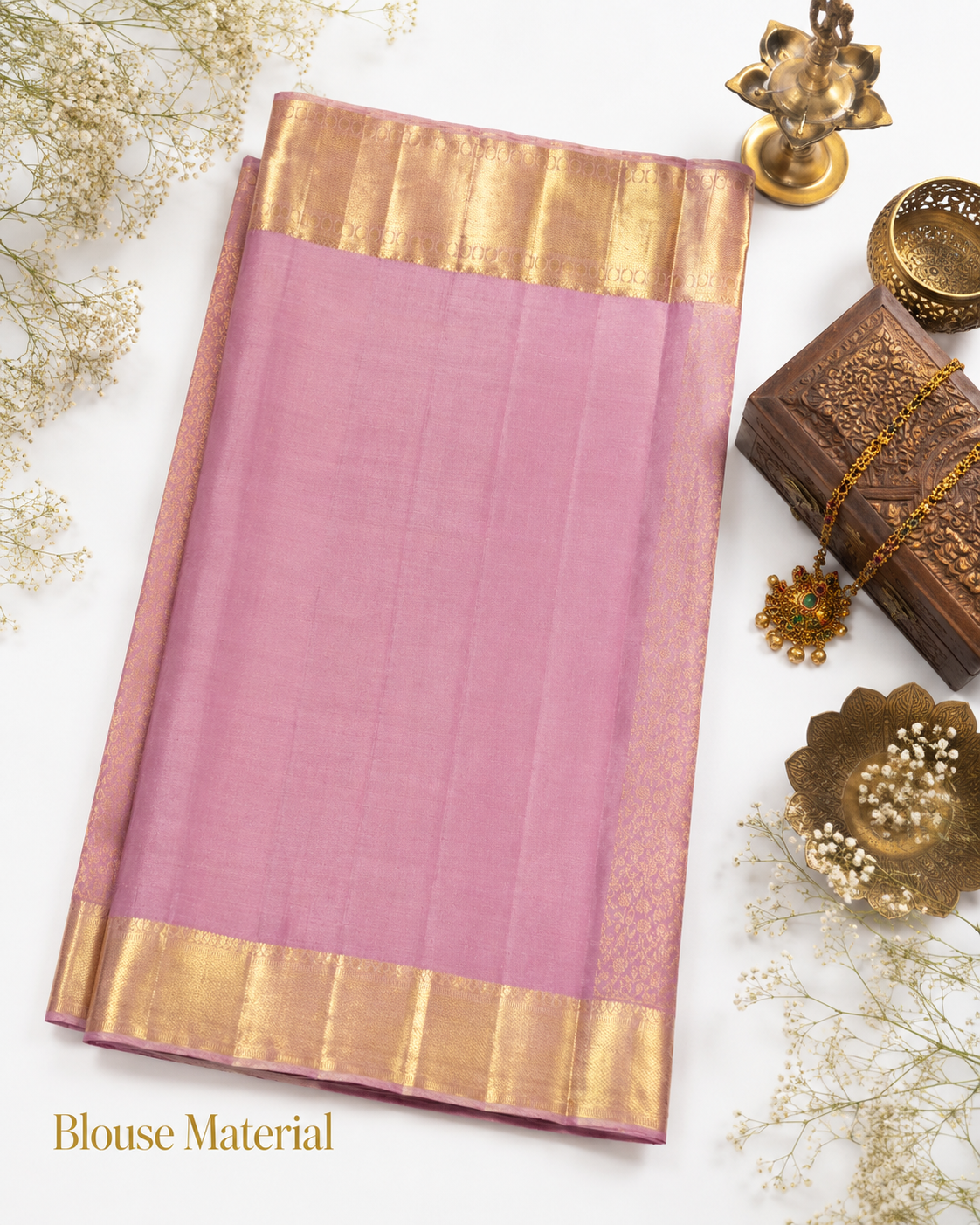 Pink blouse material with gold border on a white background