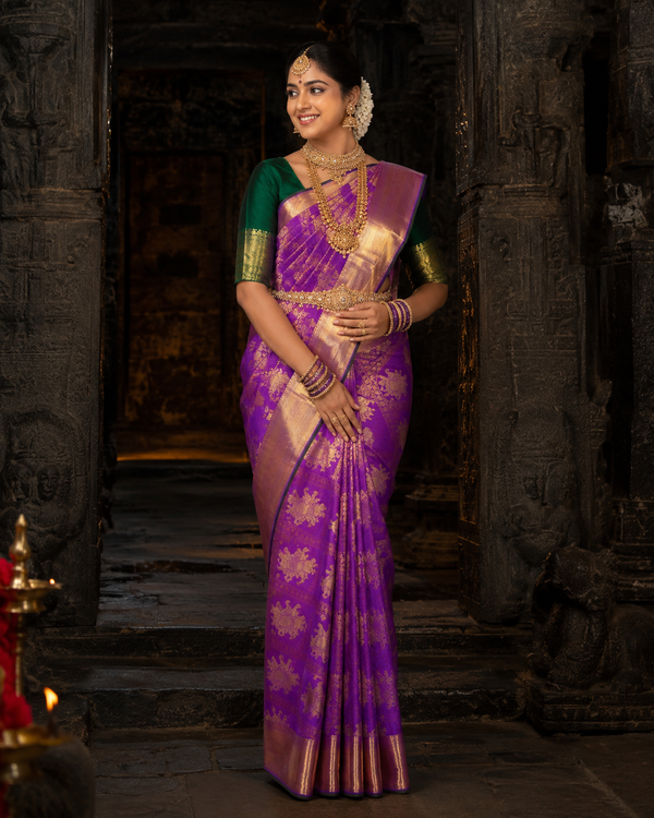 Plum purple Kanjivaram silk saree with green border and gold zari, draped on model — Plum Purple Kanjivaram Silk Saree, Vasthara Boutique