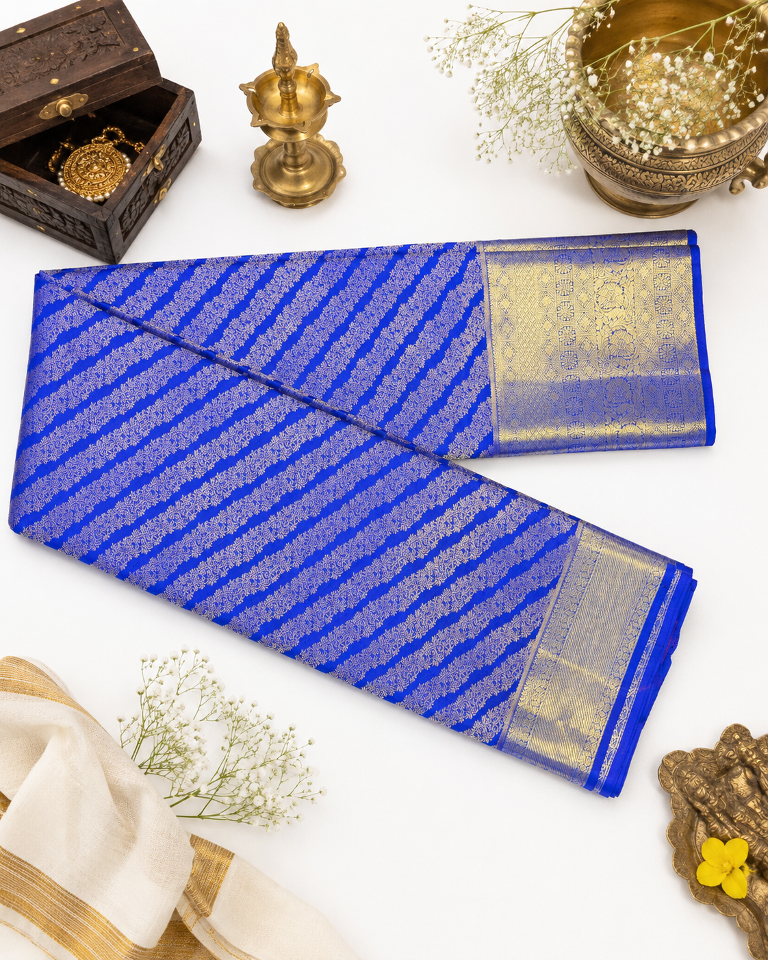 Blue saree with gold patterns on a white background
