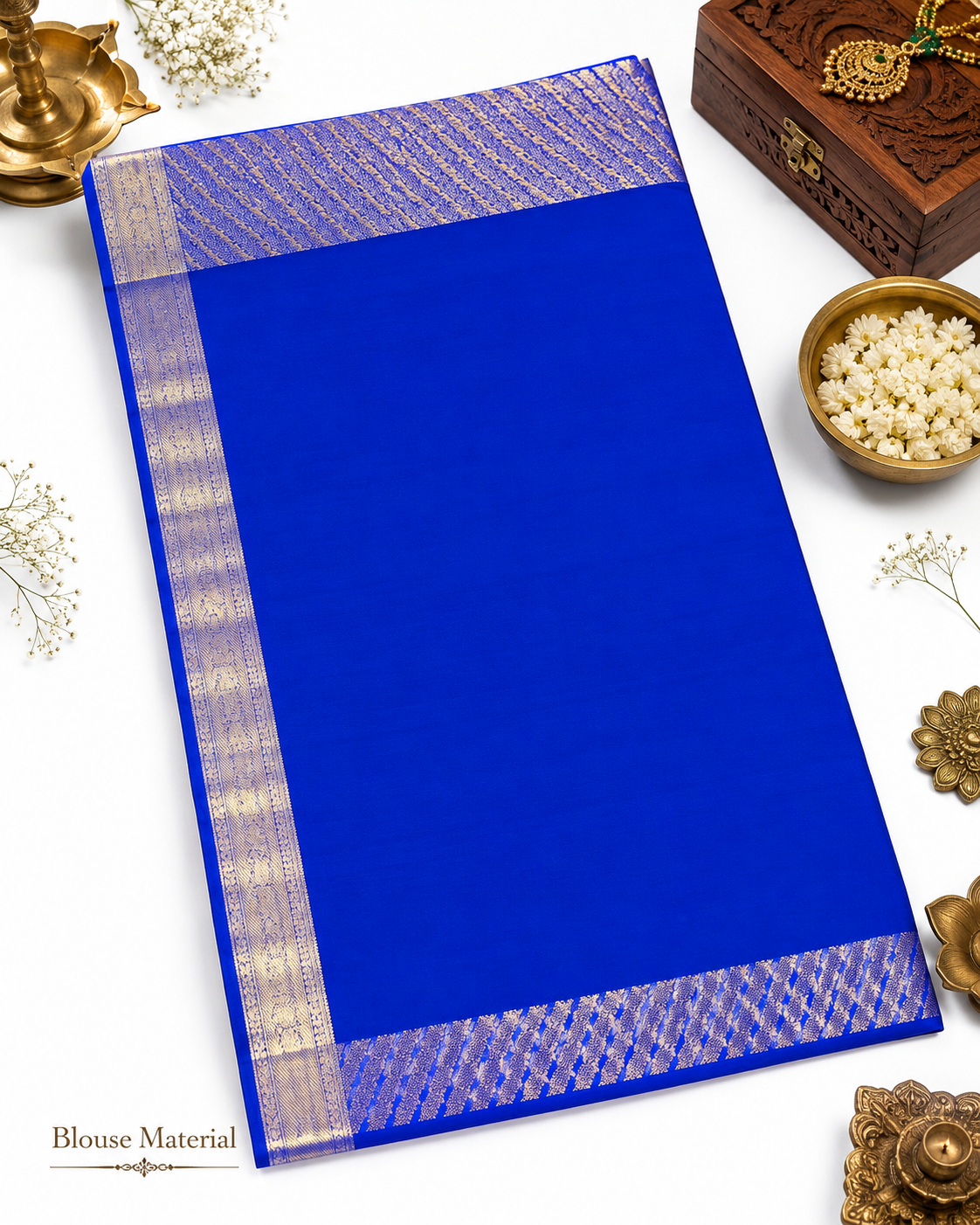 Blue saree with a decorative border on a white background